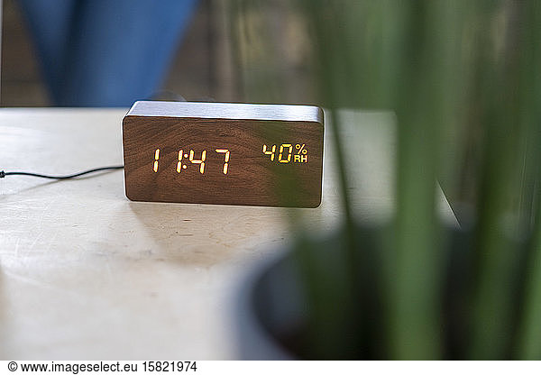 Wooden digital clock on desk