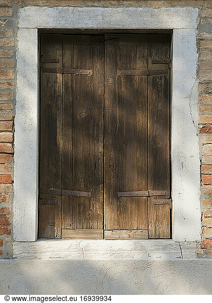 Wooden door in brick building.