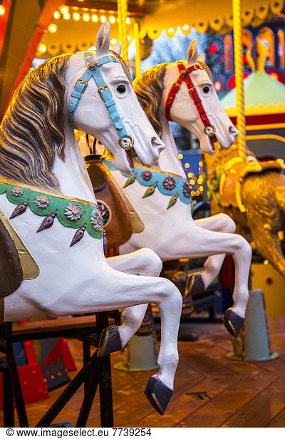 Wooden horses on a historic funfair carousel