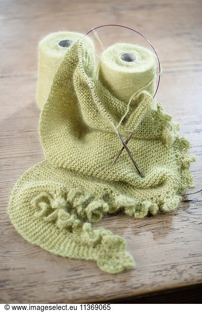 Wool reel with knitting needle in salesroom