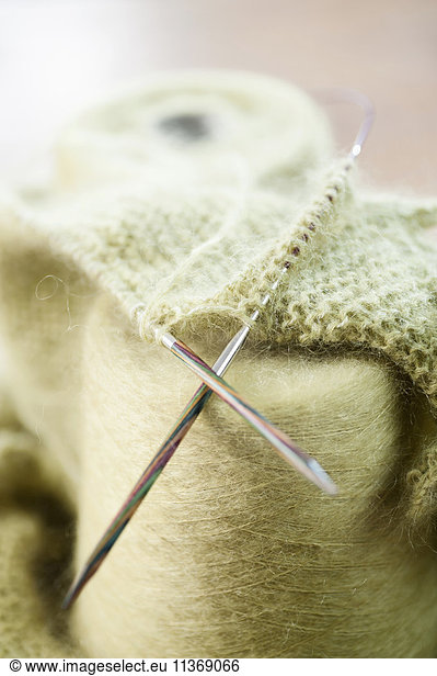 Wool reel with knitting needle in salesroom