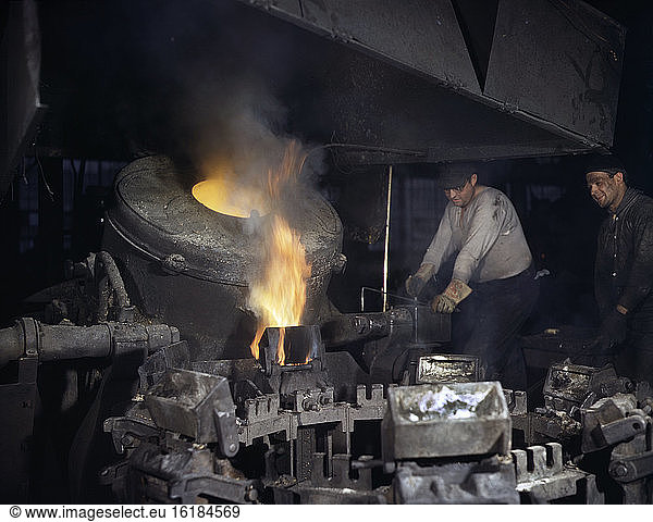 Worker Casting a Billet from an Electric Furnace  Chase Brass and Copper Co.  Euclid  Ohio  USA  Alfred T. Palmer  U.S. Office of War Information  February 1942