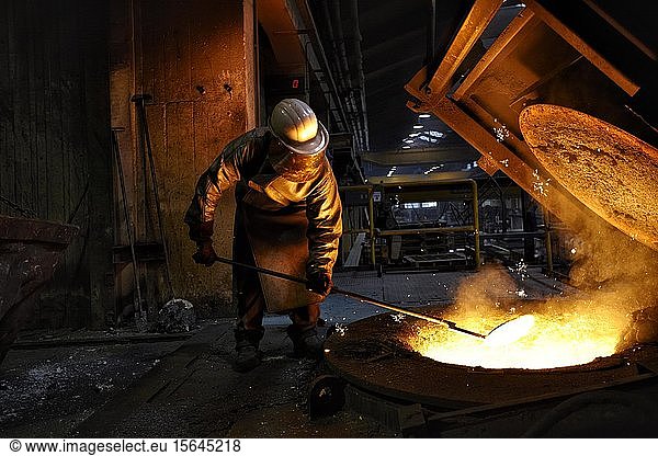 Worker on tanks with liquid iron  iron foundry  Germany  Europe