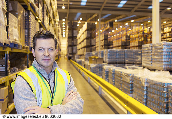 Worker smiling in warehouse