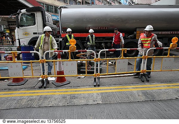 Workers in Hong Kong.   China