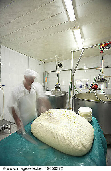 Workers making cheese in Carmelo  Uruguay.