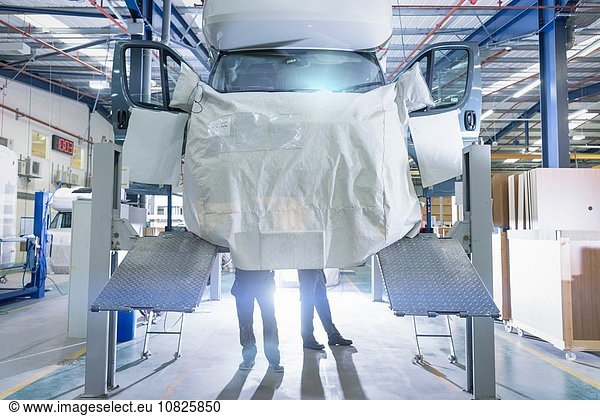 Workers on motorhome production line