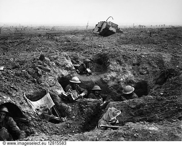 WORLD WAR I: YPRES  1917. British troops in a gun-pit trench with a destroyed Mark IV tank in the background. Photographed during the battle at Menin Road Ridge  part of the Battle of Ypres  22 September 1917.