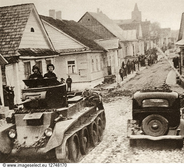 WORLD WAR II: POLAND,  1939. A Red Army tank passing through the town of Rakov during the Soviet invasion of Poland. Photograph,  September 1939.