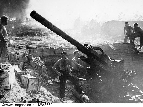 WORLD WAR II: BOUGAINVILLE. U.S. Army artillery crew in an emplacement for a 90-mm gun at the Allied base on Bougainville Island  New Guinea. Photographed late 1943.