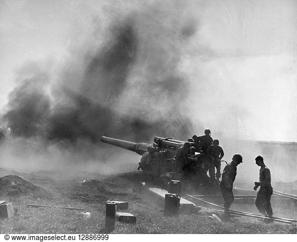 WORLD WAR II: BREST  1944. An American artillery unit firing an eight-inch gun into Brest  France  occupied by German forces. Photographed 11 September 1944.