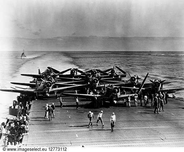 WORLD WAR II: MIDWAY  1942. Pilots and crew preparing fighter planes aboard the USS Enterprise prior to their take-off for the Battle of Midway  3-6 June 1942. Only four of the planes would return.