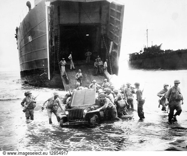 WORLD WAR II: NEW GUINEA. A stalled jeep is pushed ashore by U.S. infantrymen during the invasion of Wake Island  Dutch New Guinea  during World War II  c1943.