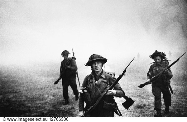 WORLD WAR II: NORMANDY. British troops advance across a field during the Allied invasion of Normandy  6 June 1944.
