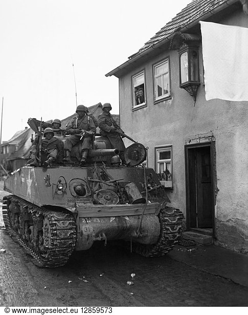 WORLD WAR II: TANKS  1945. Members of the 66th Infantry Regiment  12th Armored Division on a tank near Schneeburg  Germany.