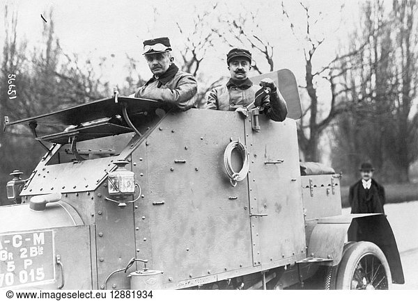 WWI: ARMORED CAR  c1915. Two soldiers in an armored car  possibly in France. Photograph  c1915.