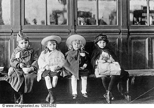 WWI: REFUGEES  c1918. French refugee children waiting for a train to return to their homes. Photograph  c1918.