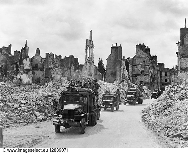 WWII: NORMANDY  1944. Allied forces advancing in Valognes  Normandy  France. Photograph by Bert Brandt  1944.