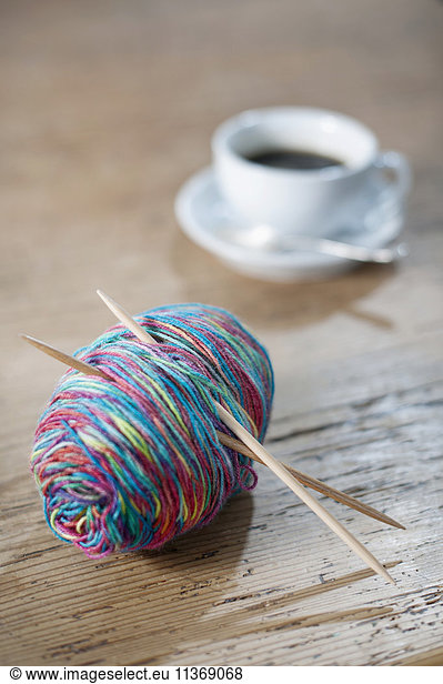 Yarn of colorful with knitting needle on wood
