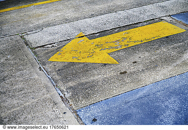 Yellow arrow symbol marking on road