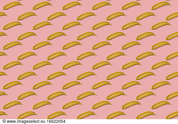Yellow banana slicer arranged on colored background