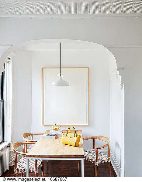 Yellow designer handbag on kitchen table