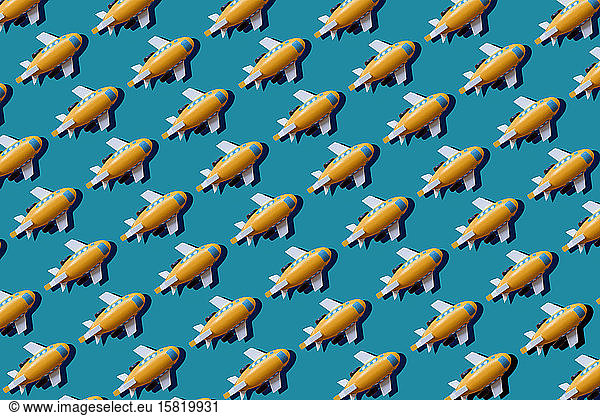 Yellow planes in a row on blue background