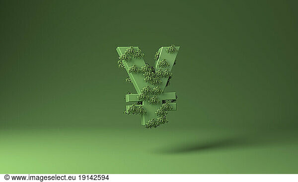 Yen or Yuan sign covered with green plants against green background