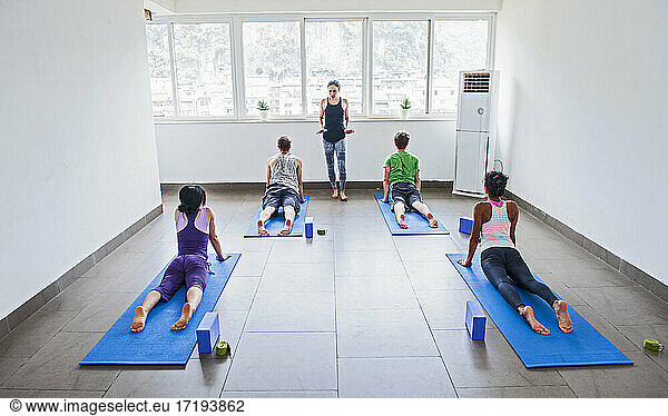 yoga teacher instructing group in Yangshuo