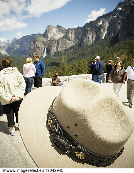 Yosemite Valley from Wawona Tunnel Overlook with a ranger's hat in the foreground  Yosemite National Park.