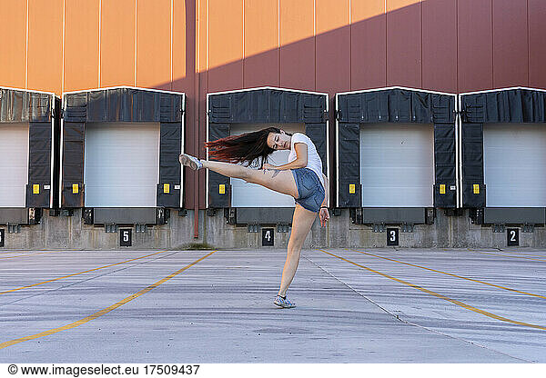 Young acrobat doing motion training