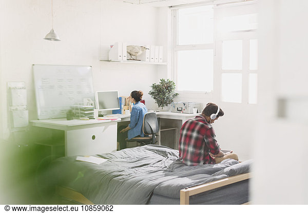 Young adults studying in apartment