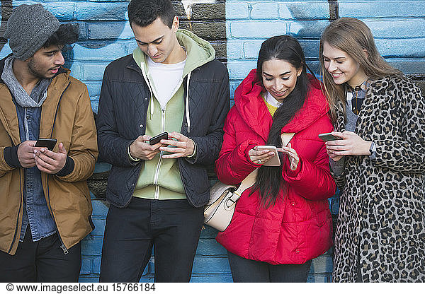 Young adults using smart phones