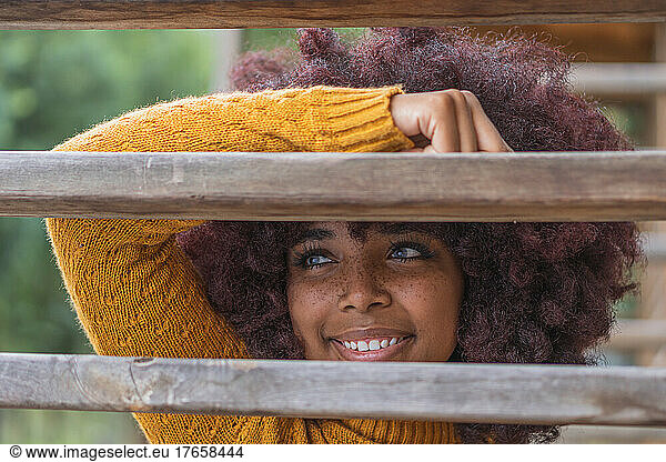Young Afro woman posing for a photograph taken outdoors