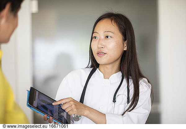 young asia doctor female woman and patientwith report in a practice