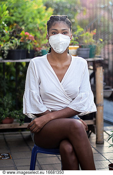 Young black woman in face mask