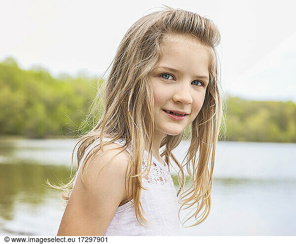 Young Blond Girl by a Lake