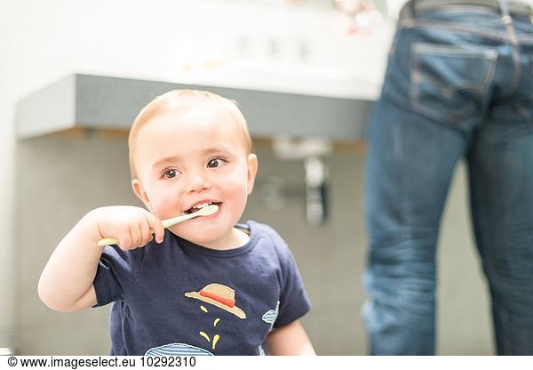 Young boy brushing teeth