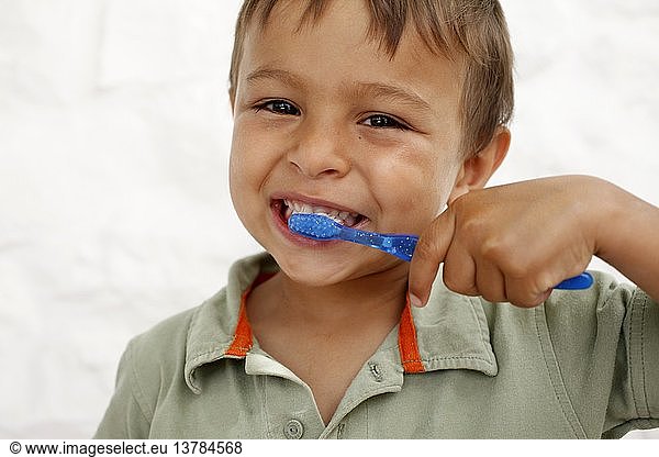 Young boy brushing teeth  Italy