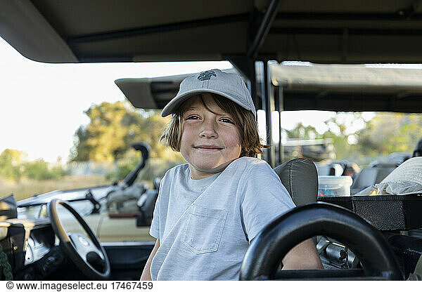 young boy in safari vehicle  Okavango Delta  Botswana