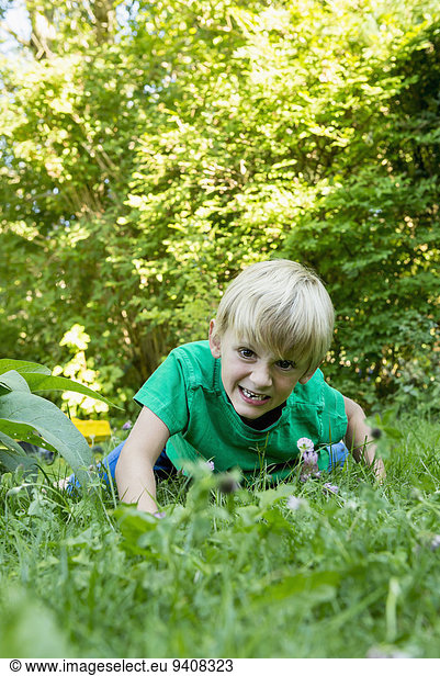 Young boy playing in the garden