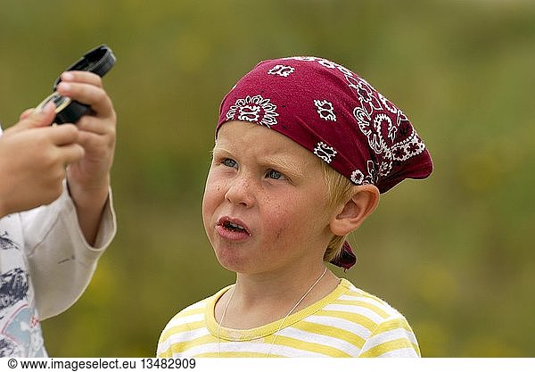 Young boy playing pirates  childish look  compass in child's hand