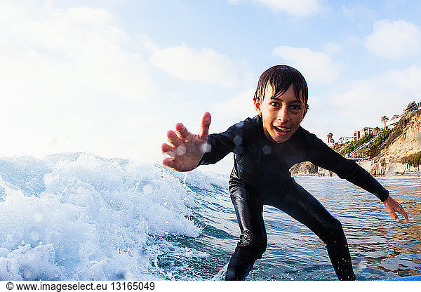 Young boy surfing  Encinitas  California  USA