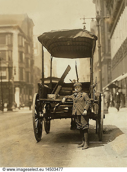 Young Boy Working as Assistant on Express Wagon  Adams Express Company  Portrait Standing with Wagon  St. Louis  Missouri  USA  Lewis Hine for National Child Labor Committee  May 1910