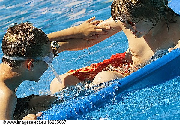 Young Boys Playing In Water