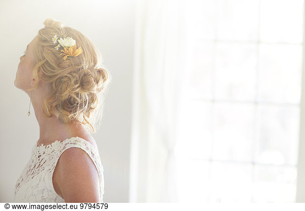 Young bride in sunny room
