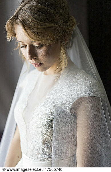 Young bride wearing white wedding dress