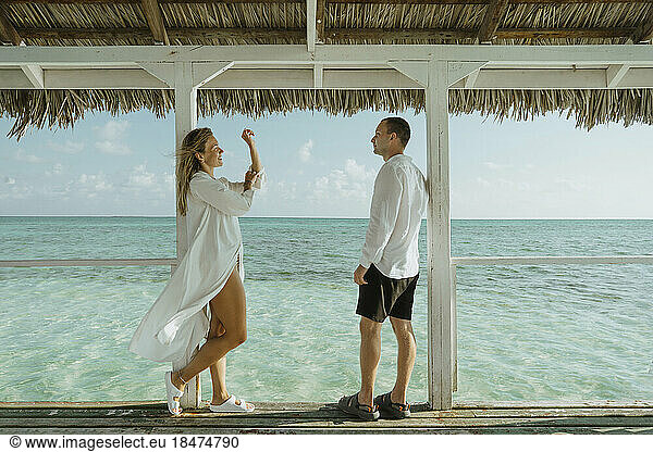 Young couple enjoying vacation near sea
