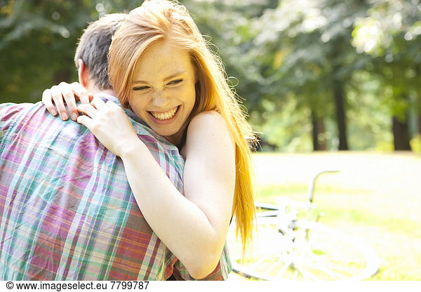 Young Couple Hugging in Park on a Summer Day  Portland  Oregon  USA