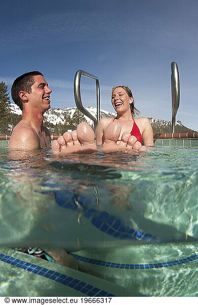 Young couple relaxing in a hot tub.